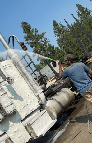 Gem State Exterior Services technician cleaning a large industrial tanker truck
